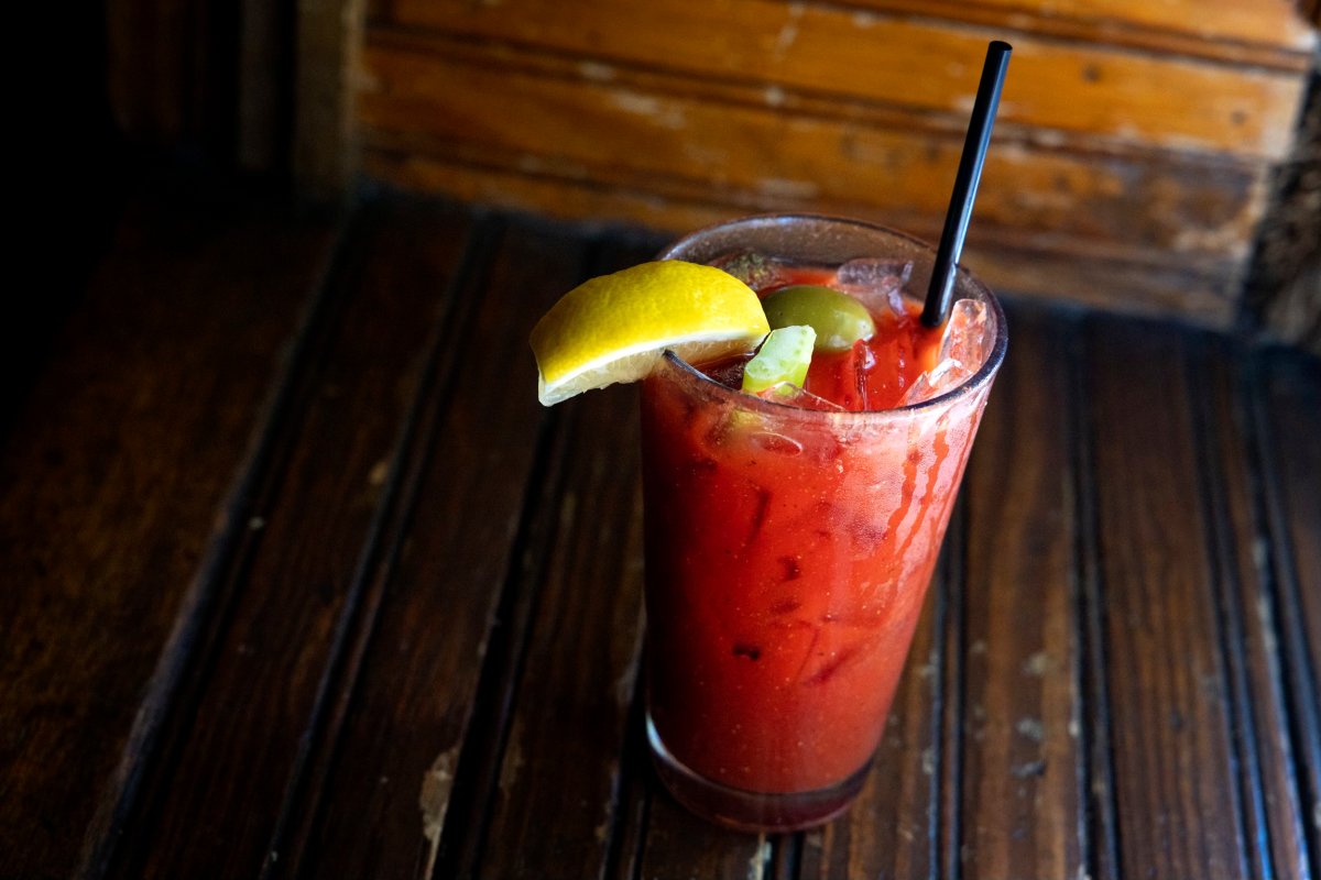 A Bloody Mary cocktail sitting on a bar