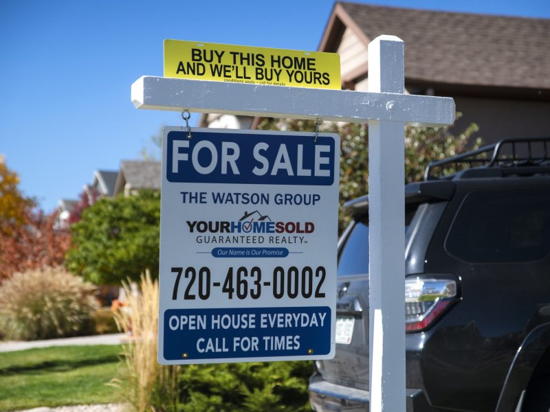 A "For Sale" in front of a house