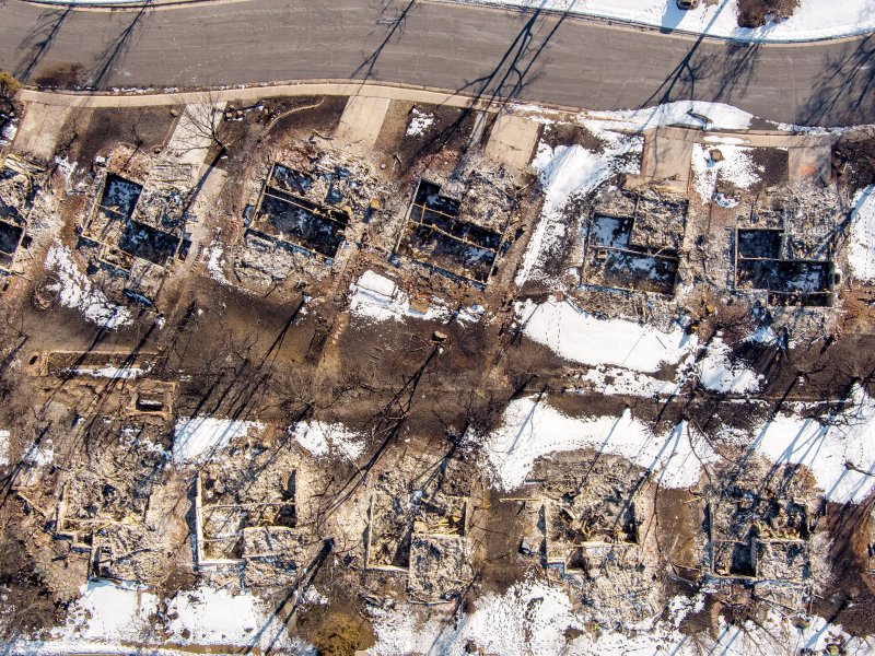 An aerial shot of burnt homes