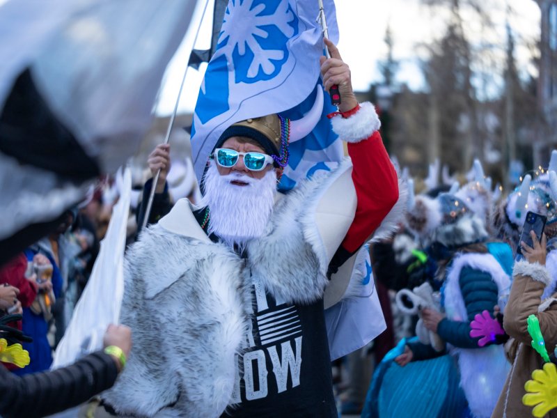 people in winter outwear with horned viking hats