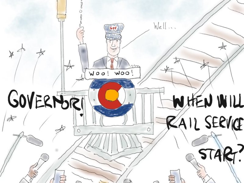 A cartoon of the governor dressed like a train conductor doing a press conference promising rail service