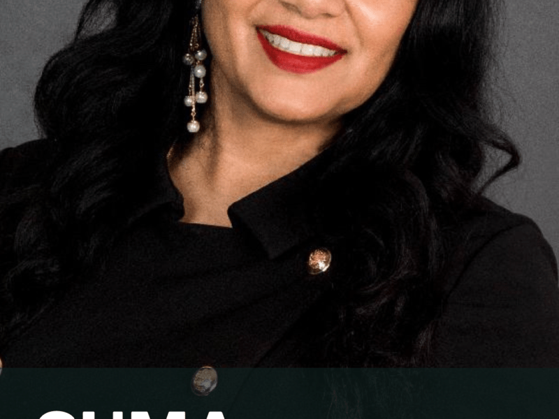 Suma Nallapati, CIO for the City and County of Denver, smiles in a professional headshot. She is wearing a dark top and earrings, set against a plain background.